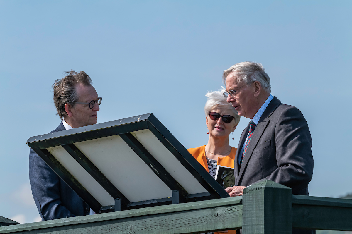 John Reid standing at the viewing platform at Trimontium fort site with the Duke of Gloucester and Kay Callander.