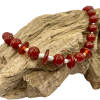 carnelian necklace, sterling silver beads, pictured on driftwood