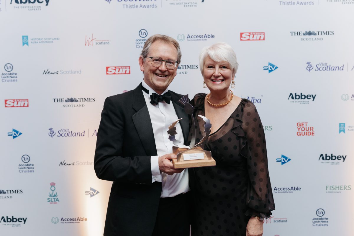 Chairman Dr John Reid and Secretary Kay Callander with the Innovation Award 2025